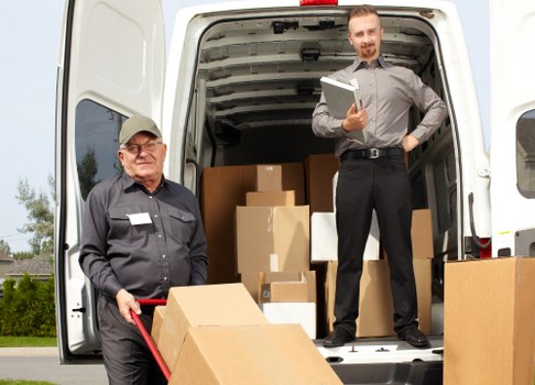 Professional house removalists in Richmonduponthames loading moving boxes