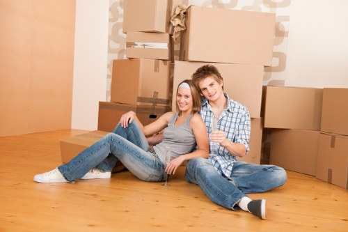 Office relocation team handling packed equipment during a move in Richmonduponthames