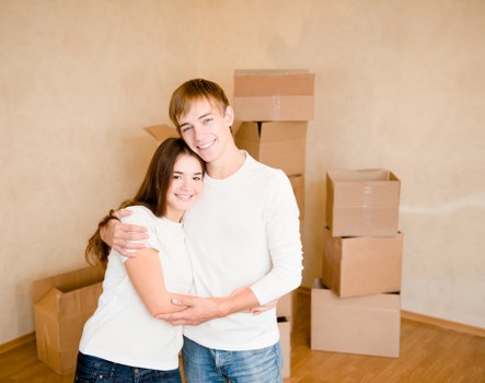 Packed furniture and boxes being loaded into a removals van