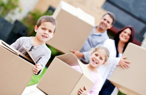 Professional movers securing furniture inside a moving truck