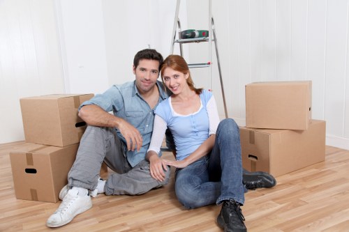 Professional movers loading furniture for same day removals