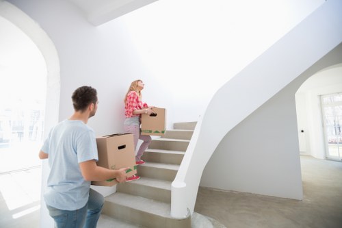Local removals team transporting furniture through Richmond upon Thames