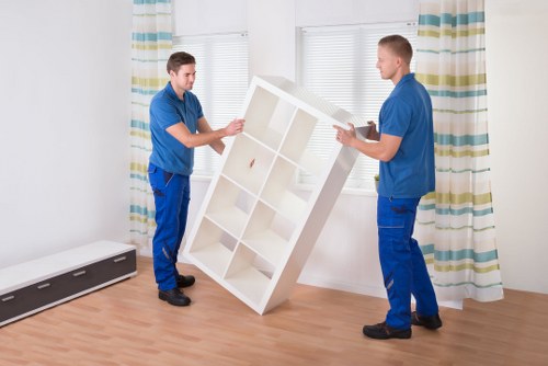 Staff assessing move details before loading items into van