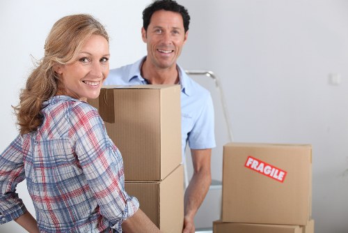 Protected movers handling items safely during a man and van service